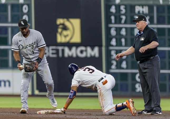 Apr 1, 2023; Houston, Texas, USA; Houston Astros shortstop Jeremy Pena (3) is safe with a RBI double against Chicago White Sox second baseman Elvis Andrus (1) in the fourth inning at Minute Maid Park.
