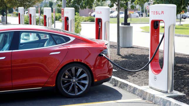 A Tesla Model S is plugged in at a vehicle Supercharging station in Seabrook, N.H., Aug. 24, 2018.
