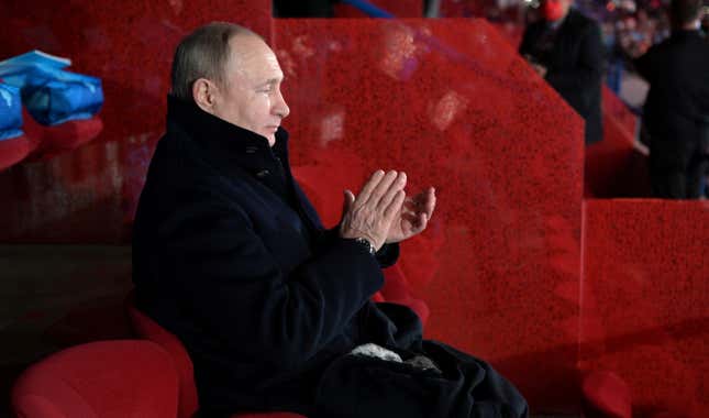 Russian President Vladimir Putin applauds during a ceremony opening the 2022 Beijing Olympic Winter Games in Beijing.
