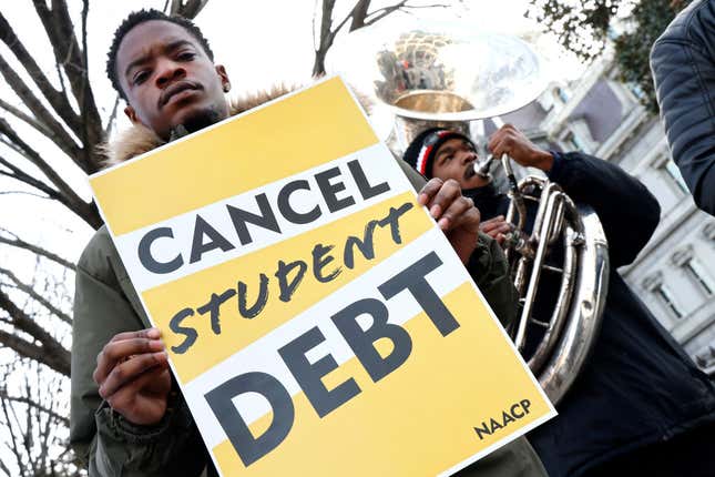 WASHINGTON, DC - JANUARY 13: Student loan borrowers and the Too Much Talent Band thank President Joe Biden and Vice President Kamala Harris for extending the student loan pause and now demand that they cancel student debt at a gathering outside The White House on January 13, 2022, in Washington, DC.