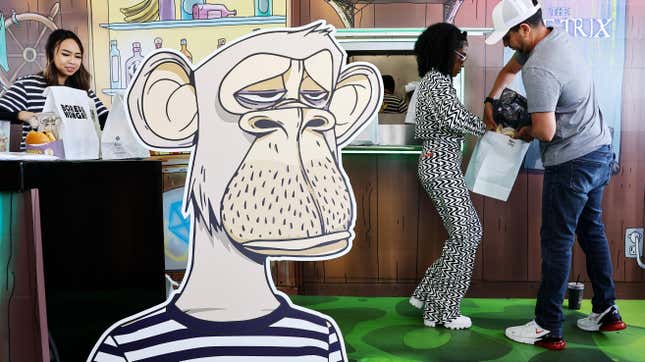A cardboard standee of a bored ape in front of restaurant patrons eating burgers.