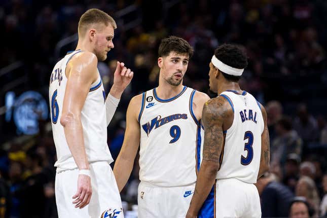Feb 13, 2023; San Francisco, California, USA; Washington Wizards center Kristaps Porzingis (6) and forward Deni Avdija (9) and guard Bradley Beal (3) talk during the second half of the game against the Golden State Warriors at Chase Center.