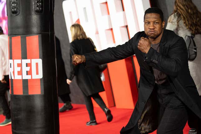 Jonathan Majors poses for photographers upon arrival for the premiere of the film “Creed III” in London