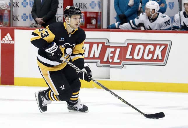 Jan 28, 2023; Pittsburgh, Pennsylvania, USA;  Pittsburgh Penguins center Teddy Blueger (53) skates with the puck against the San Jose Sharks during the third period at PPG Paints Arena. The Sharks won 6-4.