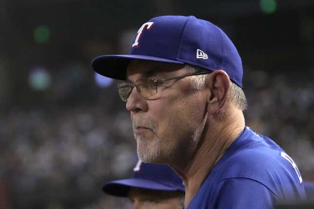 Aug 21, 2023; Phoenix, Arizona, USA; Texas Rangers manager Bruce Bochy (15) watches game action against the Arizona Diamondbacks during the third inning at Chase Field.