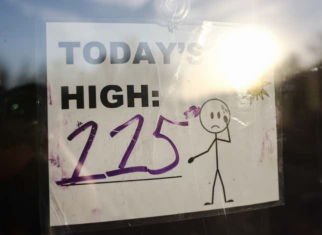 A sign reading 'Today's High: 115' is posted in South Mountain Park amid the city's worst heat wave on record on July 25, 2023 in Phoenix, Arizona.