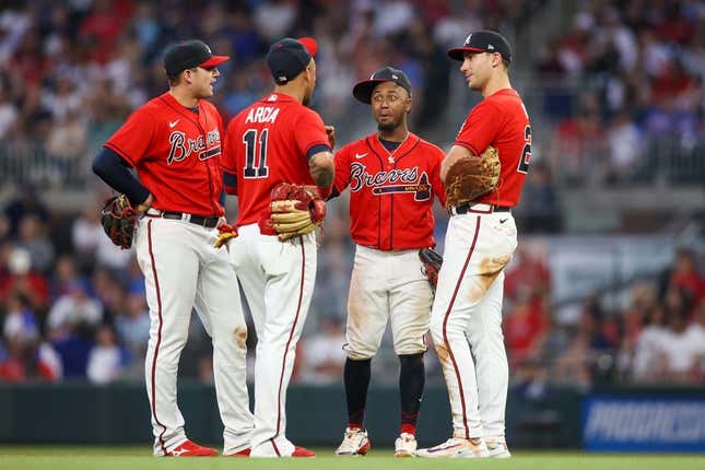 May 26, 2023; Atlanta, Georgia, USA; Atlanta Braves third baseman Austin Riley (27) and shortstop Orlando Arcia (11) and second baseman Ozzie Albies (1) and first baseman Matt Olson (28) talk during a pitching change against the Philadelphia Phillies in the sixth inning at Truist Park.