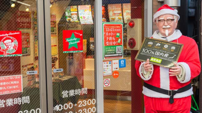 A statue of Col. Sanders dressed as Santa outside a KFC in Japan (Kentucky Fried Christmas—Japan)