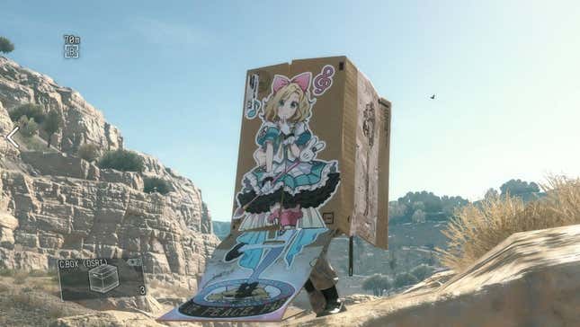 A screenshot shows a person using a box to hide in Metal Gear Solid V.