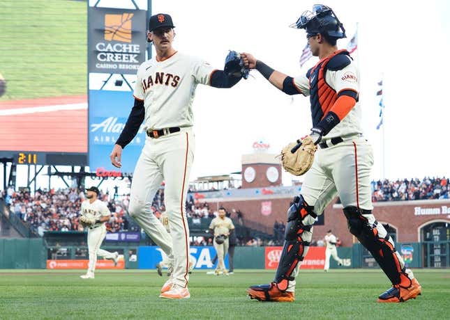 Jun 21, 2023; San Francisco, California, USA; San Francisco Giants relief pitcher Sean Hjelle (64) celebrates with catcher Black Sabol (2) after striking out a San Diego Padres batter during the fifth inning at Oracle Park.