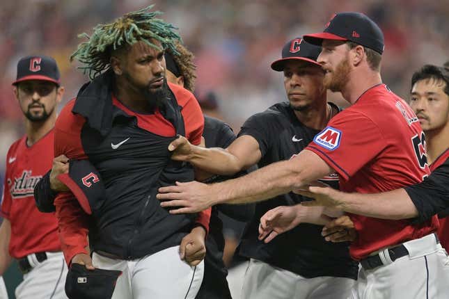 Aug 5, 2023; Cleveland, Ohio, USA; Teammates restrain Cleveland Guardians relief pitcher Emmanuel Clase (48) after a fight during the sixth inning at Progressive Field.