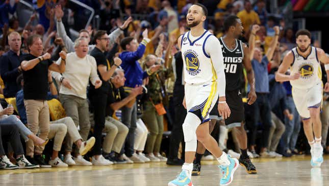 Stephen Curry reacts after making a basket against the Sacramento Kings during Game Four of the Western Conference First Round Playoffs.