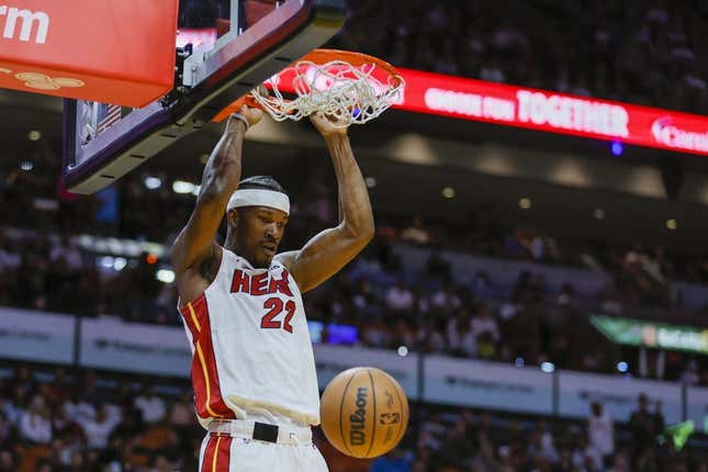 Apr 11, 2023; Miami, Florida, USA; Miami Heat forward Jimmy Butler (22) dunks the ball during the third quarter against the Atlanta Hawks at Kaseya Center.