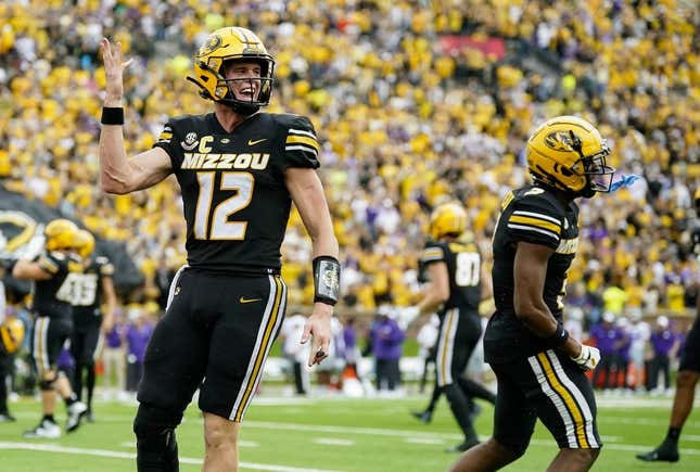 Sep 16, 2023; Columbia, Missouri, USA; Missouri Tigers quarterback Brady Cook (12) and wide receiver Luther Burden III (3) celebrate after a touchdown during the second half against the Kansas State Wildcats at Faurot Field at Memorial Stadium.
