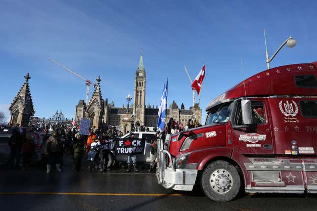 Supporters of the Freedom Convoy protest against Covid-19 vaccine mandates and restrictions in front of Parliament of Canada in January 28, 2022 in Ottawa, Canada. - A convoy of truckers started off from Vancouver on January 23, 2022 on its way to protest against the mandate in the capital city of Ottawa. 