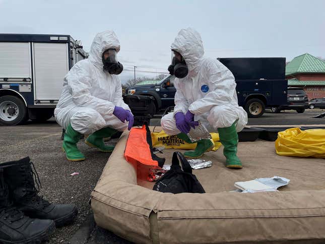This photo provided by the Ohio National Guard, ONG 52nd Civil Support Team members prepare to enter an incident area to assess remaining hazards with a lightweight inflatable decontamination system (LIDS) in East Palestine, Ohio, Tuesday, Feb. 7, 2023.