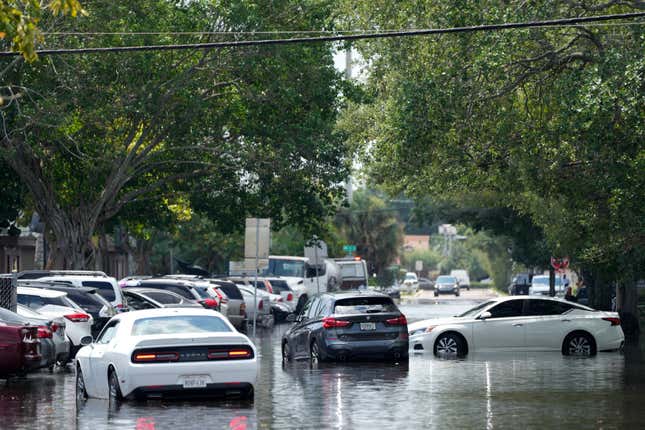 Waterlogged vehicles sit abandoned amid receding floodwaters in the Durrs neighborhood of Fort Lauderdale, Florida on Thursday, April 13, 2023. 
