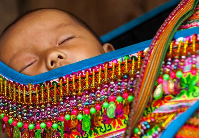 A baby from the Hmong ethnic group.