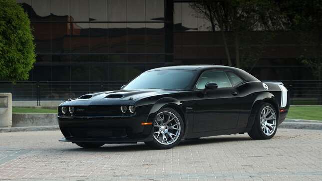 A photo of a black Dodge Challenger muscle car.