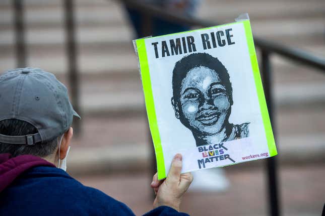 A supporter holds a sign on Tuesday, November 9, 2021, in Cleveland, during a rally for Tamir Rice, who was killed by police in 2014.