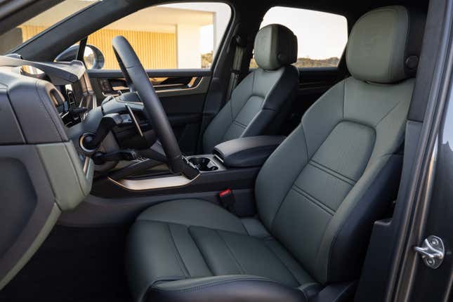The interior of the 2024 Porsche Cayenne S SUV. It's green and black.