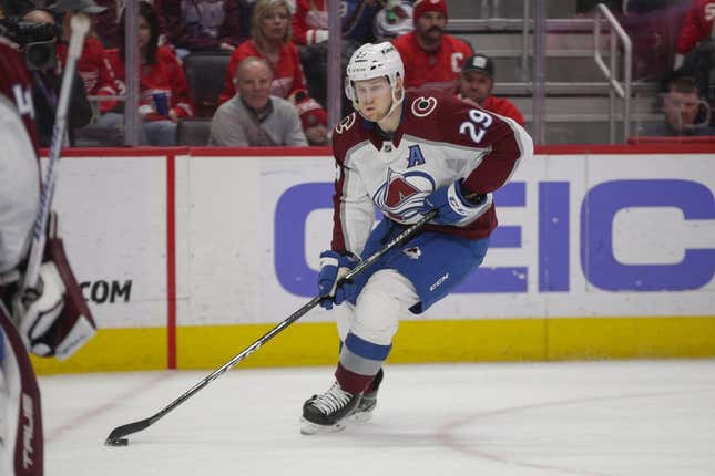 Mar 18, 2023; Detroit, Michigan, USA; Colorado Avalanche center Nathan MacKinnon (29) handles the puck during the second period at Little Caesars Arena.