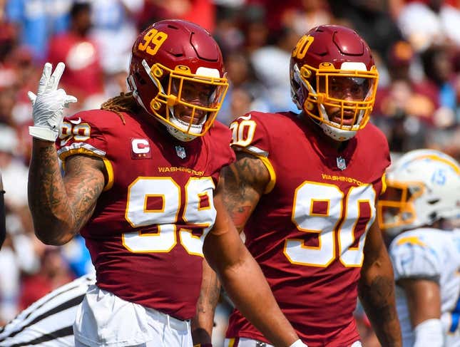 Sep 12, 2021; Landover, Maryland, USA; Washington Football Team defensive end Chase Young (99) and defensive end Montez Sweat (90) on the field against the Los Angeles Chargers during the first quarter at FedExField.