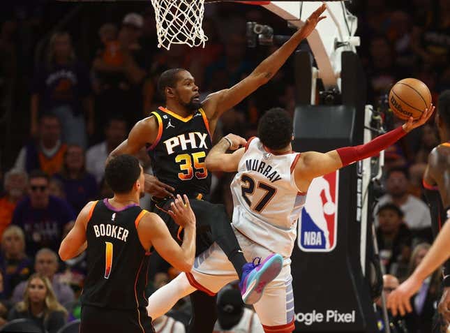 May 5, 2023; Phoenix, Arizona, USA; Phoenix Suns forward Kevin Durant (35) defends against Denver Nuggets guard Jamal Murray (27) in the first half during game three of the 2023 NBA playoffs at Footprint Center.