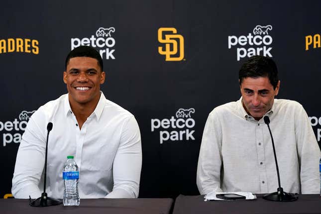 Juan Soto smiles as he sits alongside Padres president of baseball operations and “big spender” A.J. Preller.