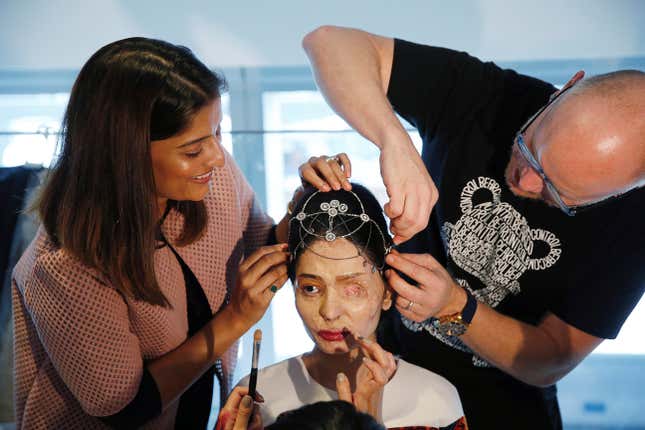 Indian model and acid attack survivor Reshma Quereshi has make up applied before walking to present Indian designer Archana Kochhar's Spring/Summer 2017 collections during New York Fashion Week in the Manhattan borough of New York, U.S., September 8, 2016. REUTERS/Lucas Jackson - RTX2OPSQ