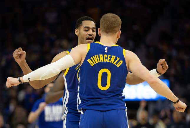 Feb 28, 2023; San Francisco, California, USA; Golden State Warriors guard Jordan Poole (left) and teammate Donte DiVincenzo (0) celebrate during the fourth quarter against the Portland Trail Blazers at Chase Center.
