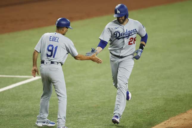 Jul 22, 2023; Arlington, Texas, USA; Los Angeles Dodgers designated hitter J.D. Martinez (28) is congratulated by third base coach Dino Ebel (91) after hitting a three-run home run against the Texas Rangers in the fourth inning at Globe Life Field.