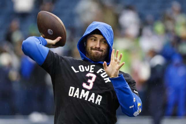 Jan 8, 2023; Seattle, Washington, USA; Los Angeles Rams quarterback Baker Mayfield (17) participates in early pregame warmups against the Seattle Seahawks while wearing a    Love for Damar    t-shirt in honor of Buffalo Bills safety Damar Hamlin (3, not pictured) at Lumen Field.