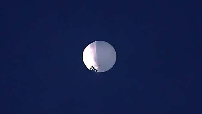 A photo of a white spy balloon in the sky over Montana.