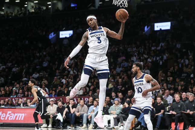 Apr 4, 2023; Brooklyn, New York, USA;  Minnesota Timberwolves forward Jaden McDaniels (3) grabs a rebound in the fourth quarter against the Brooklyn Nets at Barclays Center.