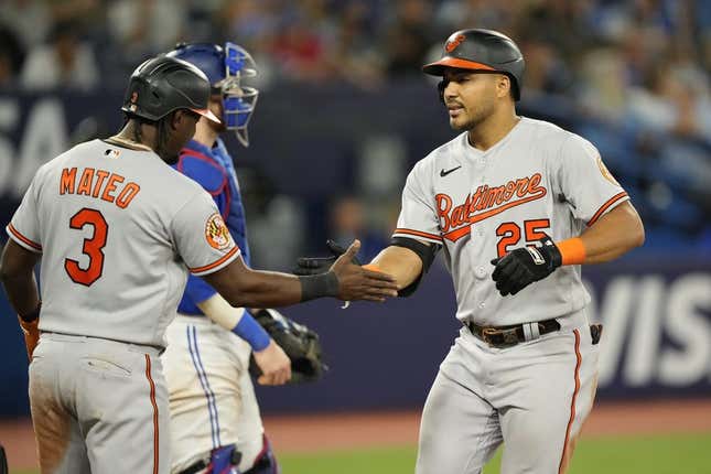 Aug 1, 2023; Toronto, Ontario, CAN; Baltimore Orioles shortstop Jorge Mateo (3) congratulates right fielder Anthony Santander (25) on his grand slam home run against the Toronto Blue Jays during the eighth inning at Rogers Centre.