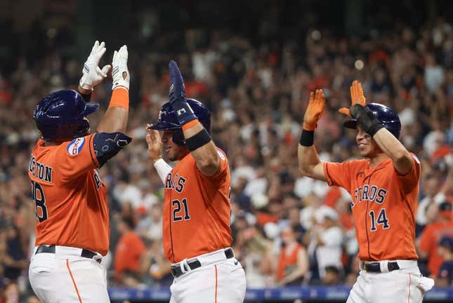 Aug 11, 2023; Houston, Texas, USA; Houston Astros first baseman Jon Singleton (28) celebrates his three run home run with designated hitter Yainer Diaz (21) and  center fielder Mauricio Dubon (14) in the second inning at Minute Maid Park.