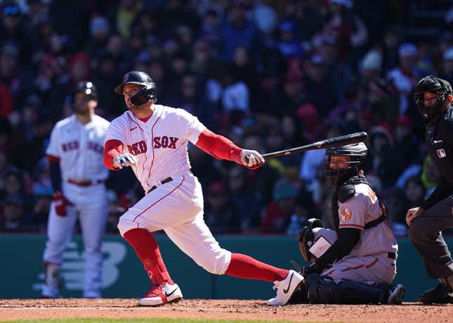 Apr 2, 2023; Boston, Massachusetts, USA; Boston Red Sox center fielder Adam Duvall (18) hits a double against the Baltimore Orioles in the third inning at Fenway Park.