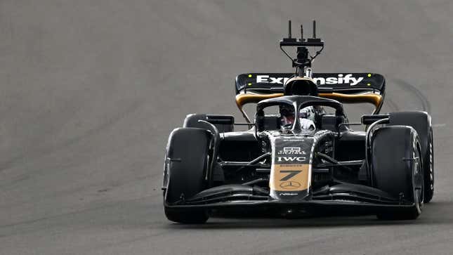 A photo of a black and gold F2 car on track in Silverstone. 