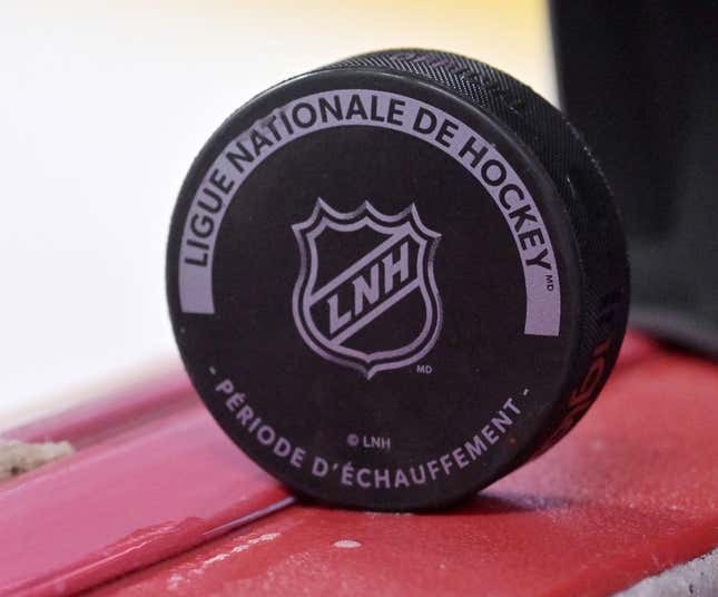 Oct 4, 2022; Montreal, Quebec, CAN; A puck with the NHL logo during the warmup period before the game between the Ottawa Senators and the Montreal Canadiens at the Bell Centre.