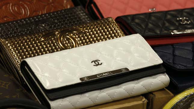 Counterfeit wallets are displayed by Customs and Excise Department during a news conference in Hong Kong September 19, 2014. The customs and the police in the territory have conducted a joint operation to combat the selling of counterfeit products at two storehouses, seizing 2,360 counterfeit goods valued at over HK$1 million (approx. $128,000). Two men were arrested in the operation, according to the official press release from the customs.