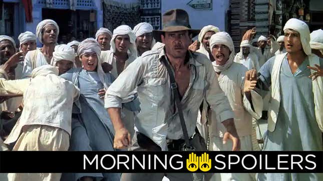 Indiana Jones stands crouched in front of a crowd of yelling Egyptians in a scene from Raiders of the Lost Ark.
