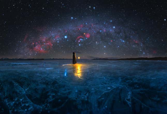 A frozen lake in Tibet, the Milky Way above it.