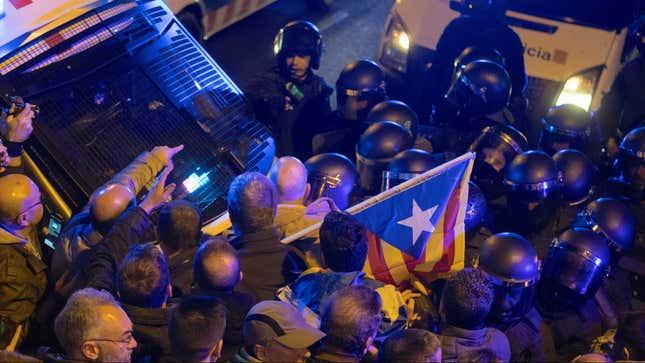 Catalonian riot police clash with protesters.