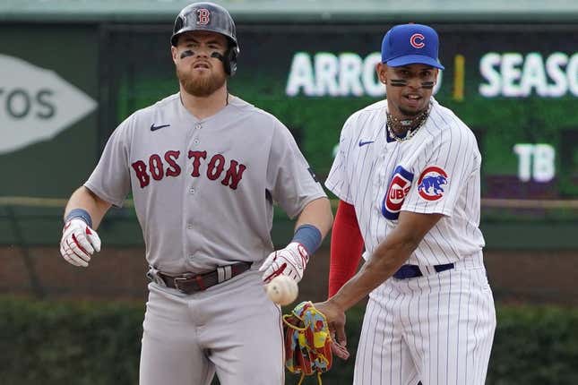 Jul 15, 2023; Chicago, Illinois, USA; Boston Red Sox second baseman Christian Arroyo (39) is safe at second base with a double as Chicago Cubs second baseman Christopher Morel (5) takes the throw during the ninth inning at Wrigley Field.