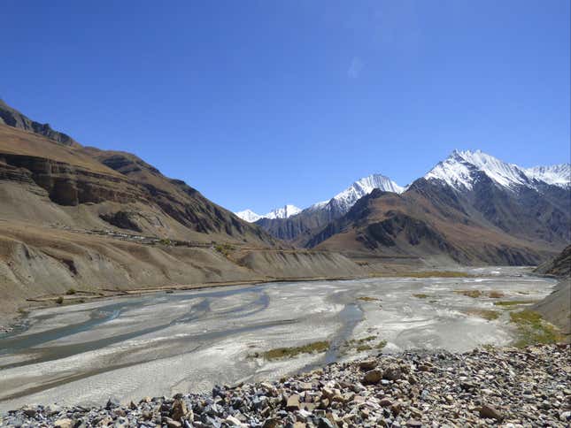 The River Pin separates horse pastures from the village.