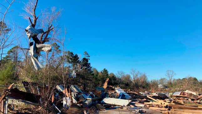 Sheet metal wrapped around a tree on December 14 in the wake of a tornado in Keithville, LA.