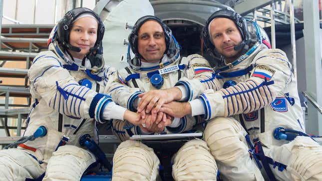Members of the ISS-66 mission. From left to right: actor Yulia Peresild, commander Anton Shkaplerov, and film director Klim Shipenko.