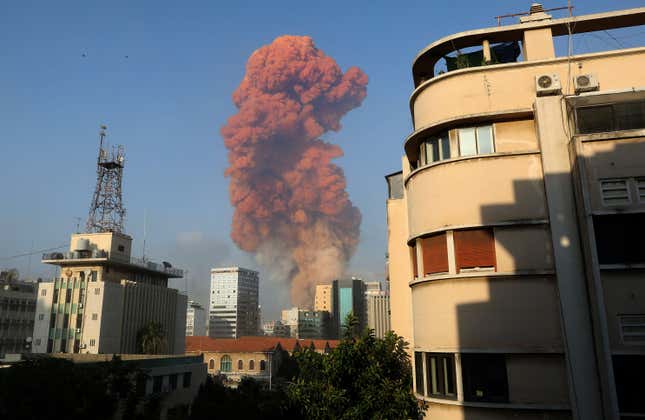A picture taken on August 4, 2020 from the Hamra district in the center of the Lebanese capital Beirut shows a smoke plume rising following a huge explosion that rocked the Port of Beirut.