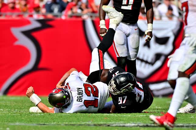 Tom Brady gets sacked in a game against the Falcons